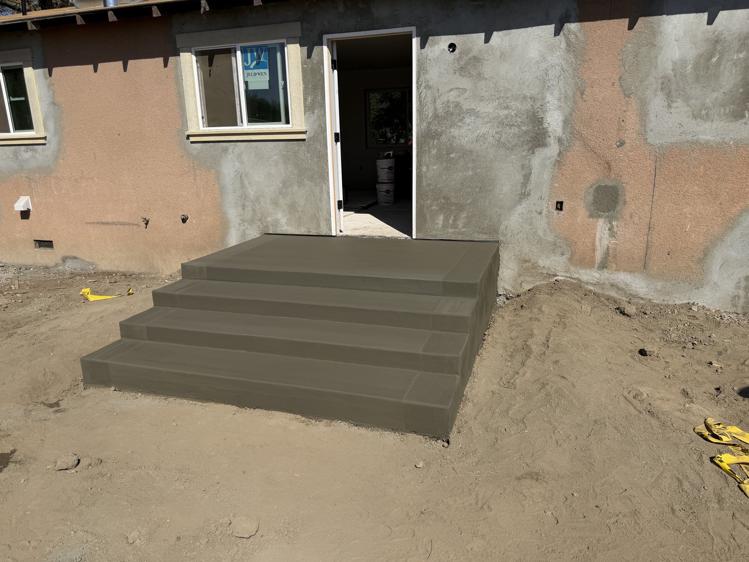Poured concrete entry steps at a home under construction