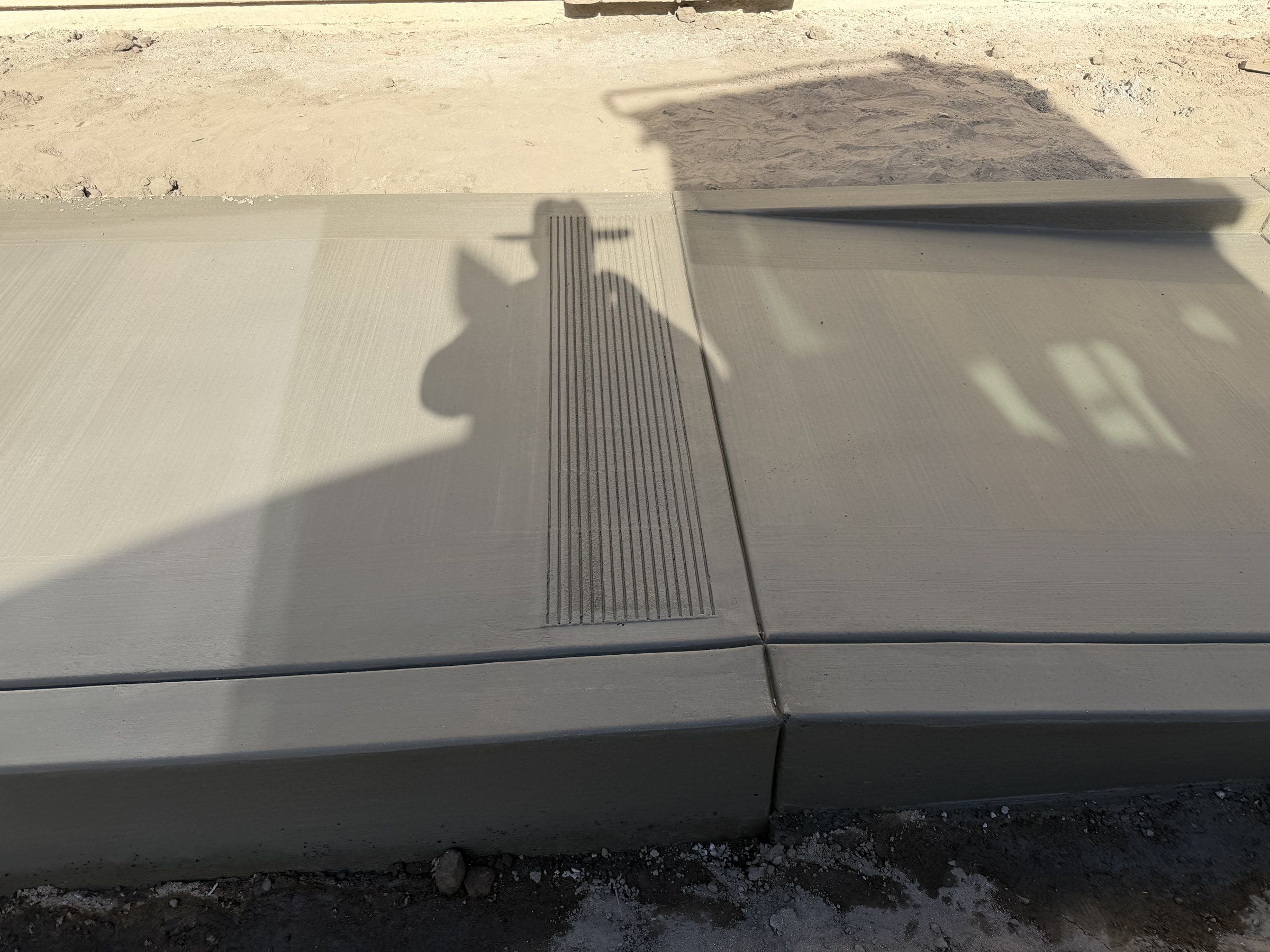Concrete slab with a trench drain at a new home