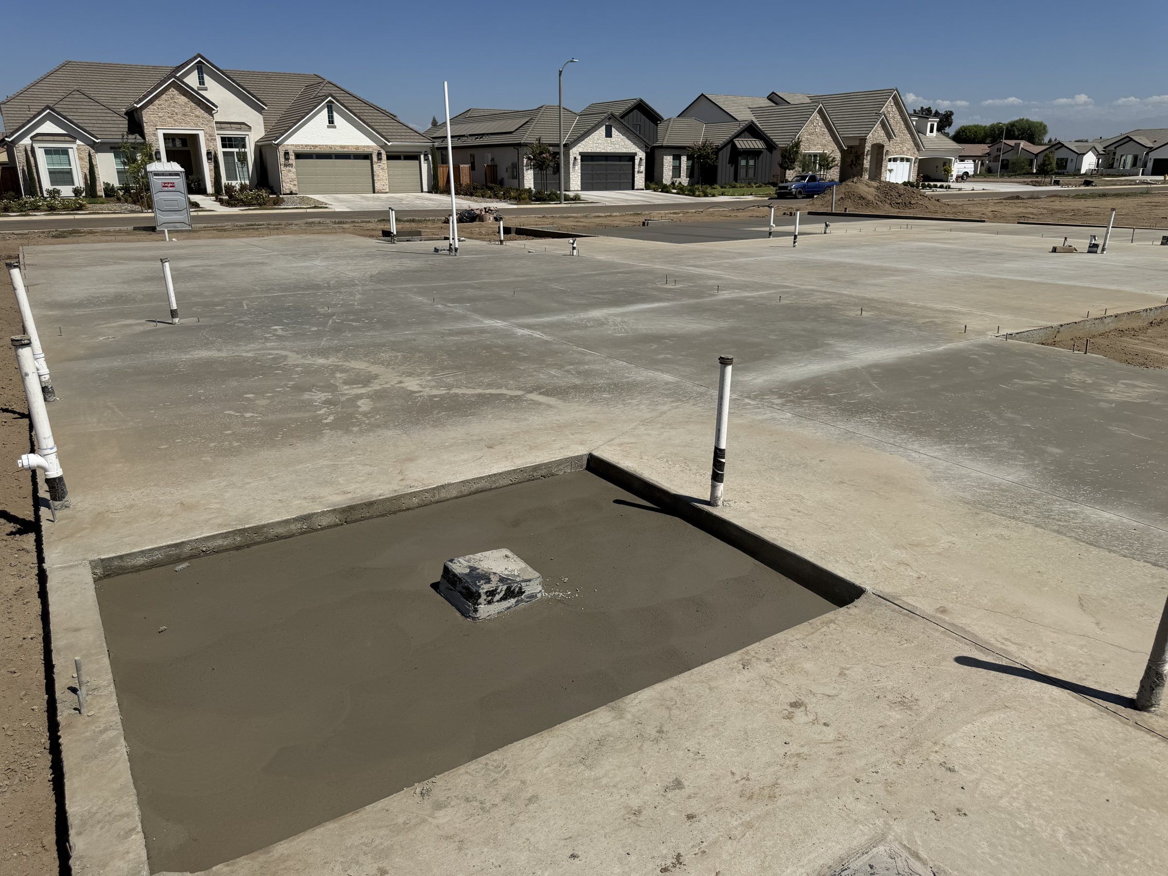 Slab section poured around a plumbing box in a new home