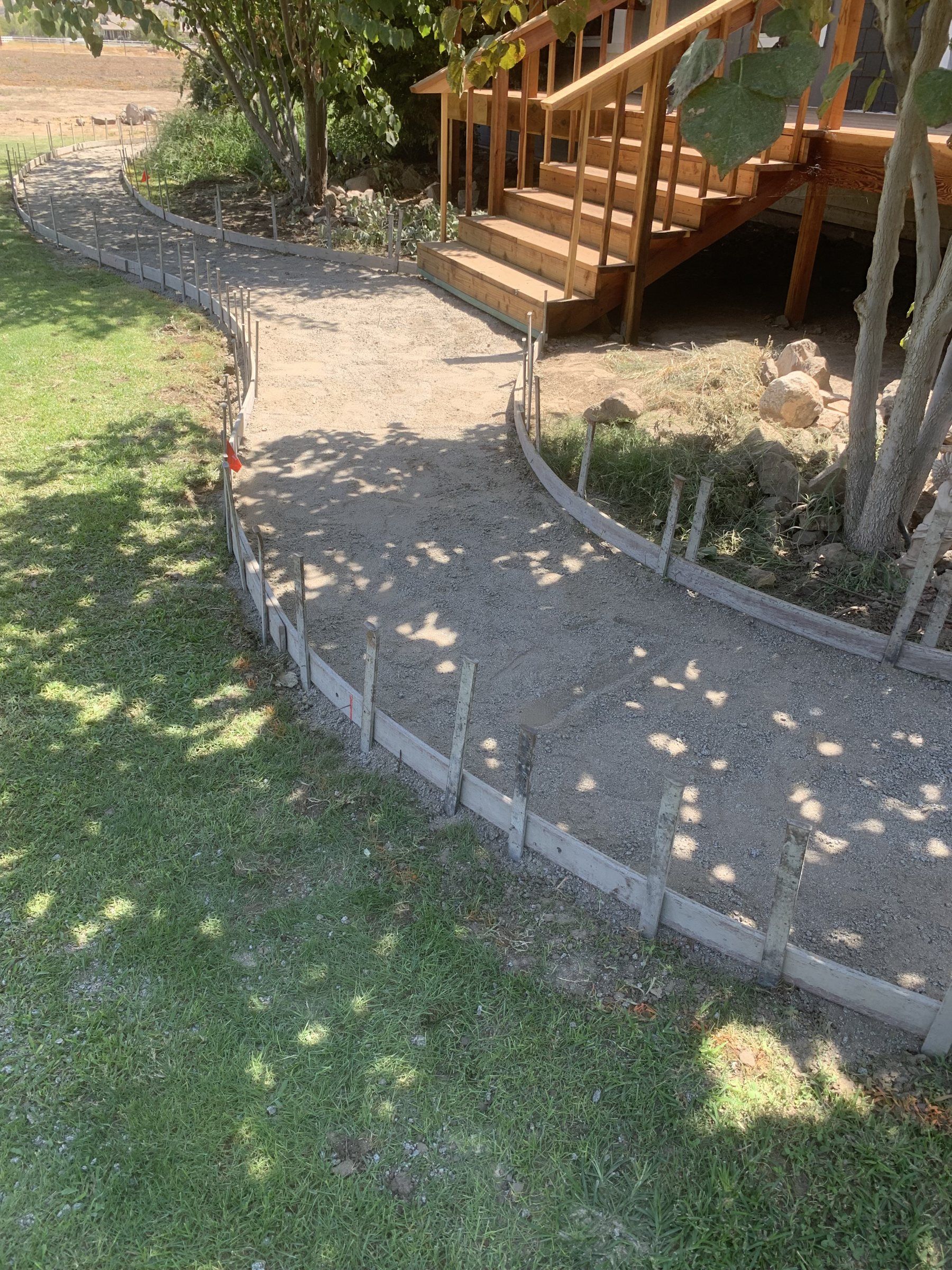 Curved forms set for a garden walkway pour