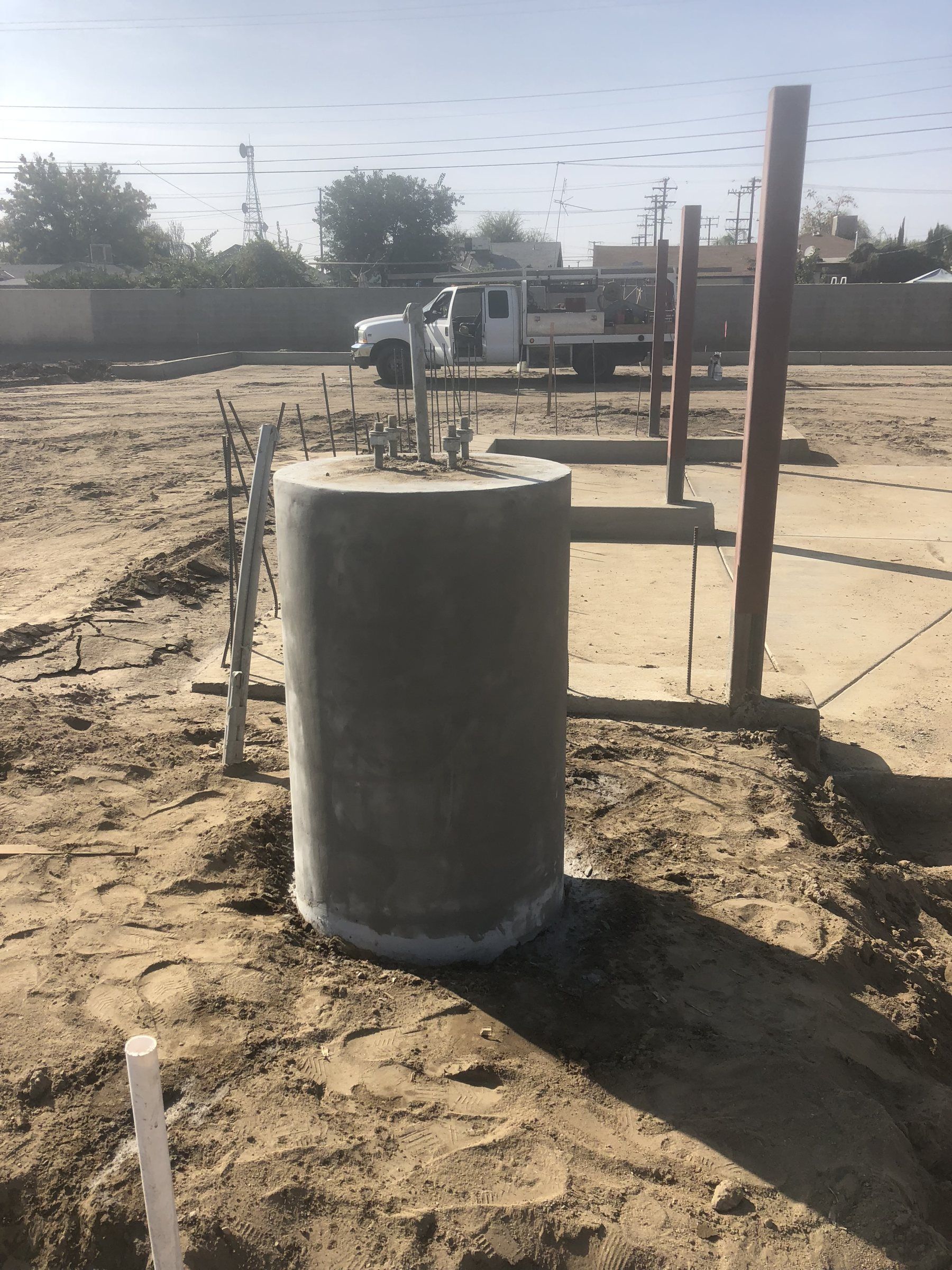 Round concrete pier footing poured on a building site