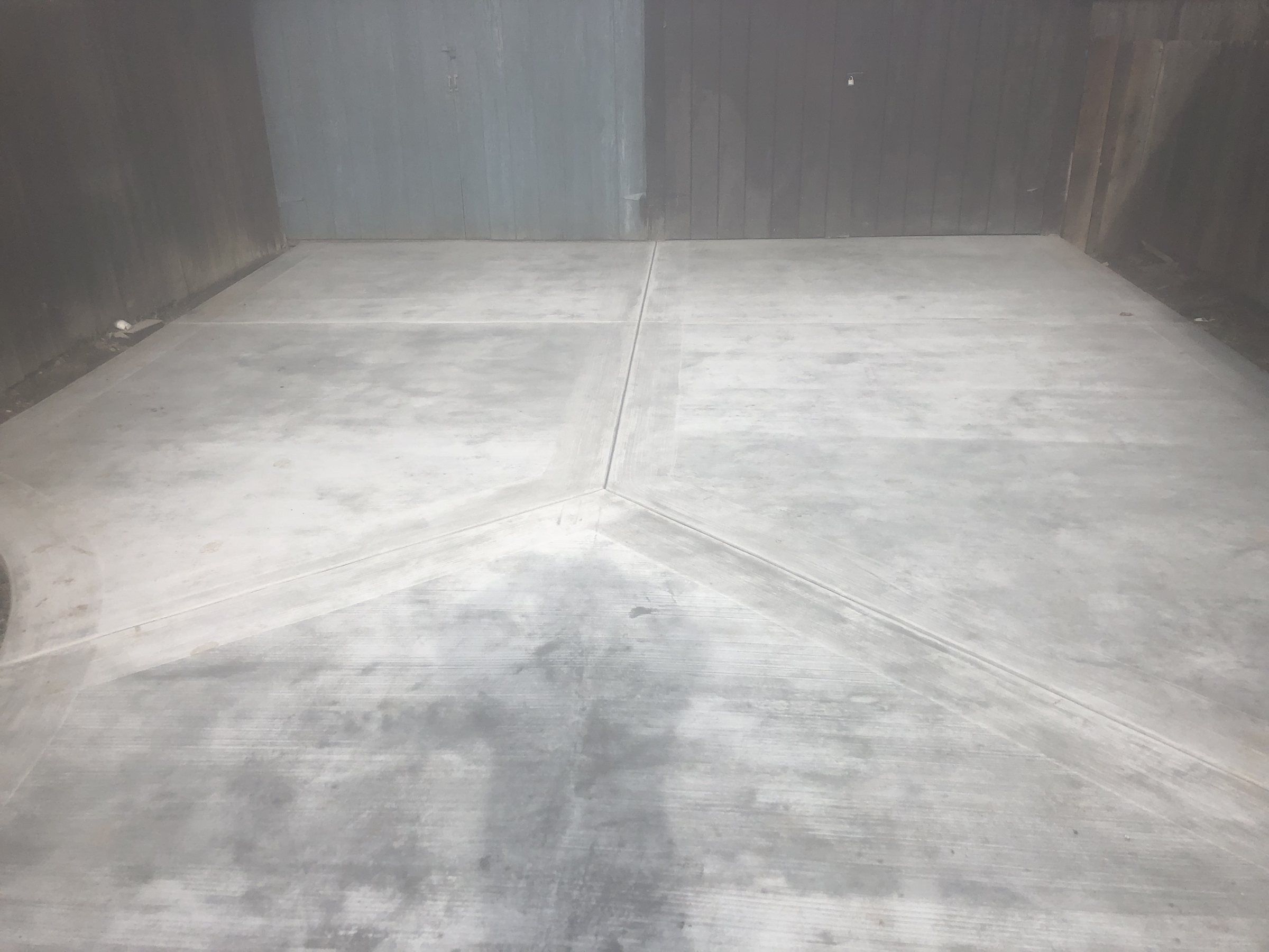 Concrete floor slab inside a garage with saw-cut joints
